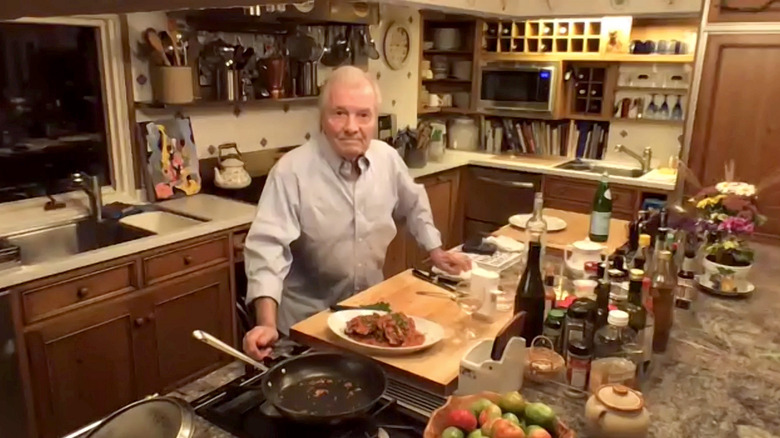 Jacques Pepin posing in his home kitchen 2020