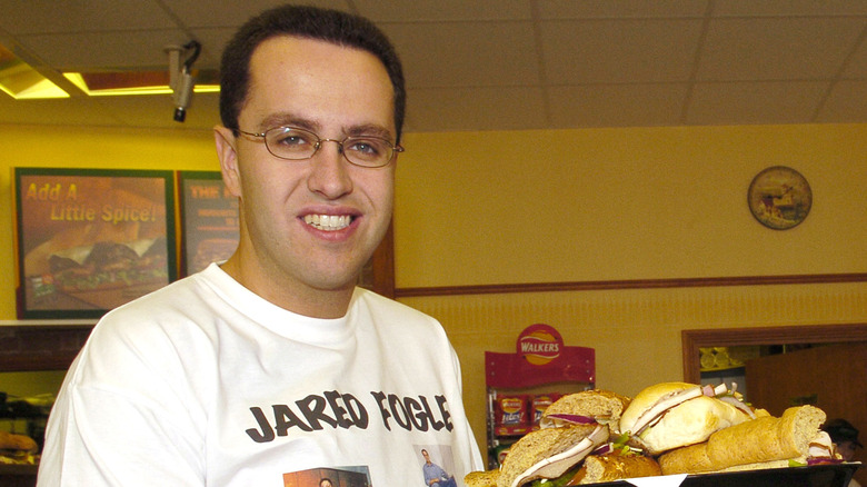 Jared Fogle holding Subway sandwiches