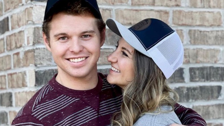 Jeremiah Duggar smiles as Hannah Wissmann hugs him