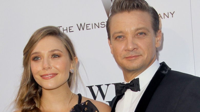 Elizabeth Olsen and Jeremy Renner posing