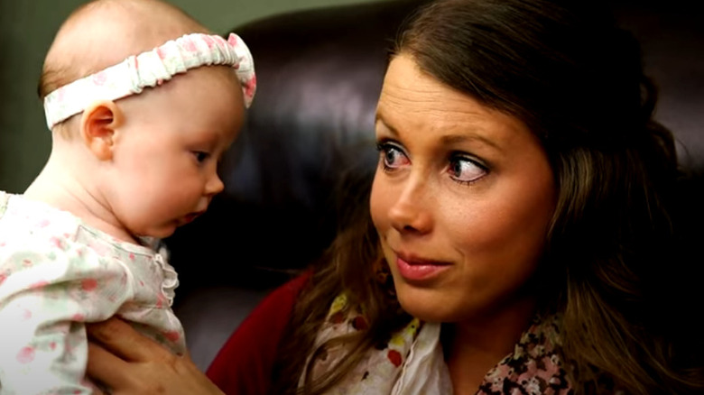 Anna Duggar holding baby