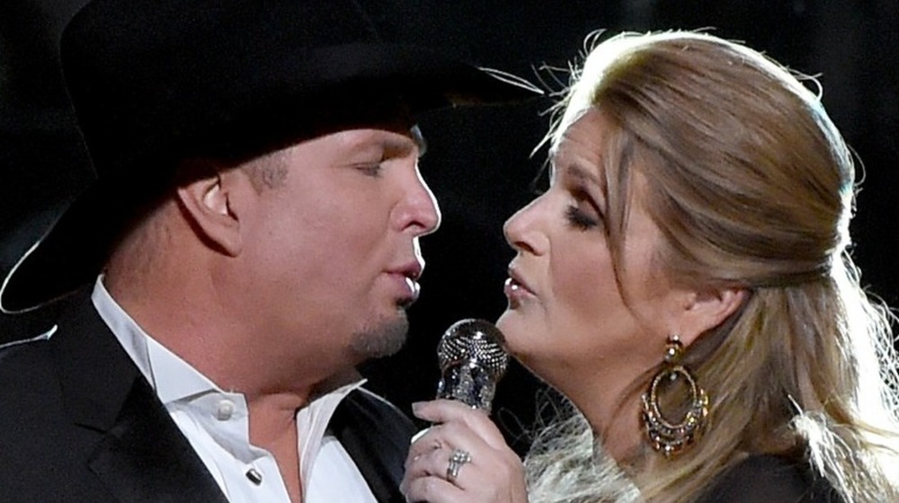 Garth Brooks and Trisha Yearwood perform onstage at the 50th annual CMA Awards in 2016