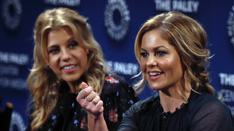 Jodie Sweetin looking at Candace Cameron Bure