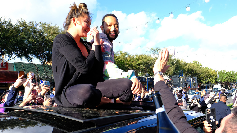 Chrissy Teigen and John Legend celebrating Biden's win in LA