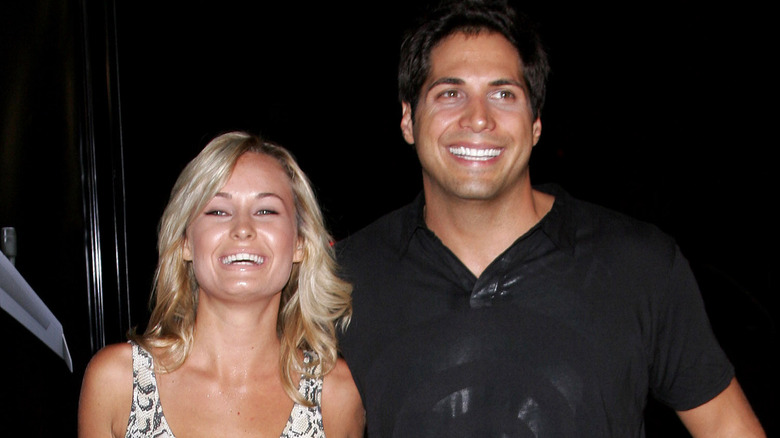 Amber Hay Joe Francis smiling leaving restaurant