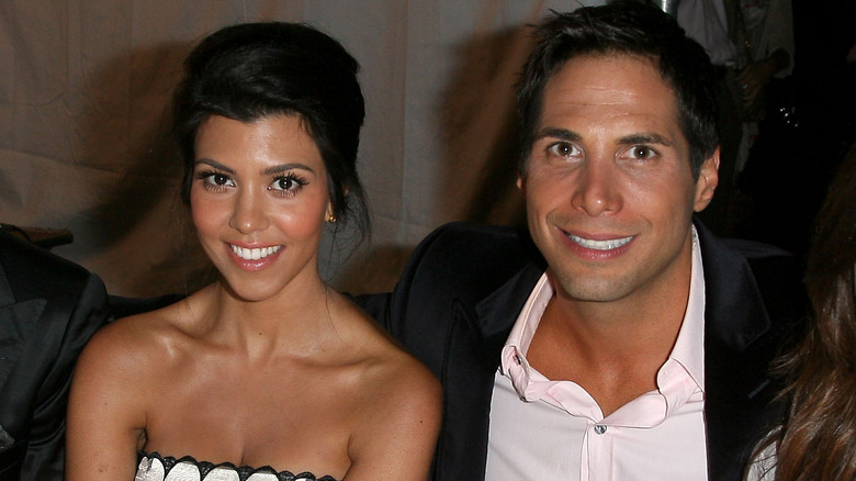 Kourtney Kardashian Joe Francis smiling dinner table