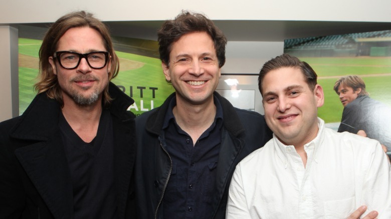 Brad Pitt, Bennett Miller, Jonah Hill smiling 