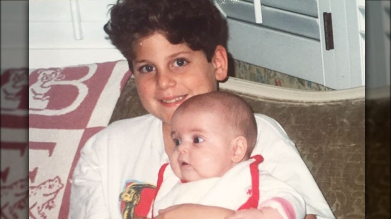 Jonah Hill holding baby