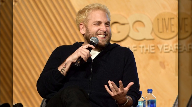 Jonah Hill talking into microphone 