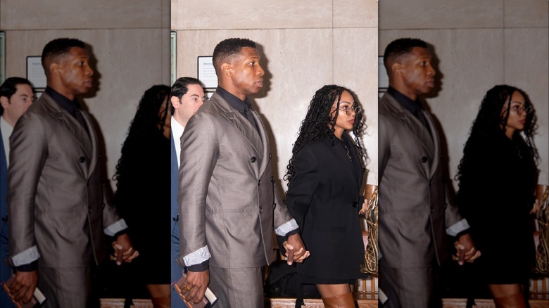 Jonathan Majors and Meagan Good holding hands