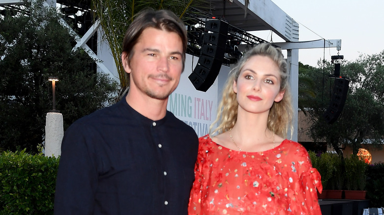 Josh Hartnett and Tamsin Egerton smiling for cameras