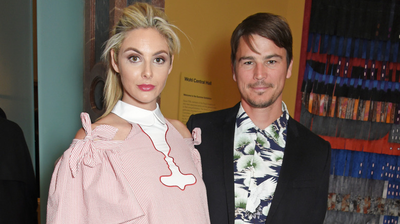 Tamsin Egerton and Josh Hartnett looking at camera