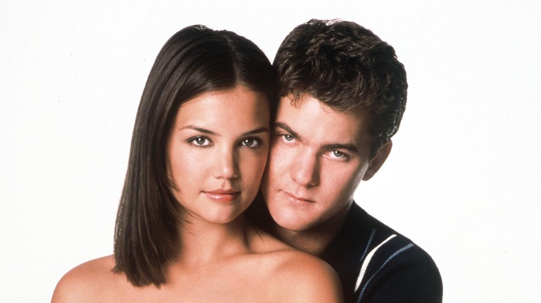 Katie Holmes and Joshua Jackson posing together against a white background