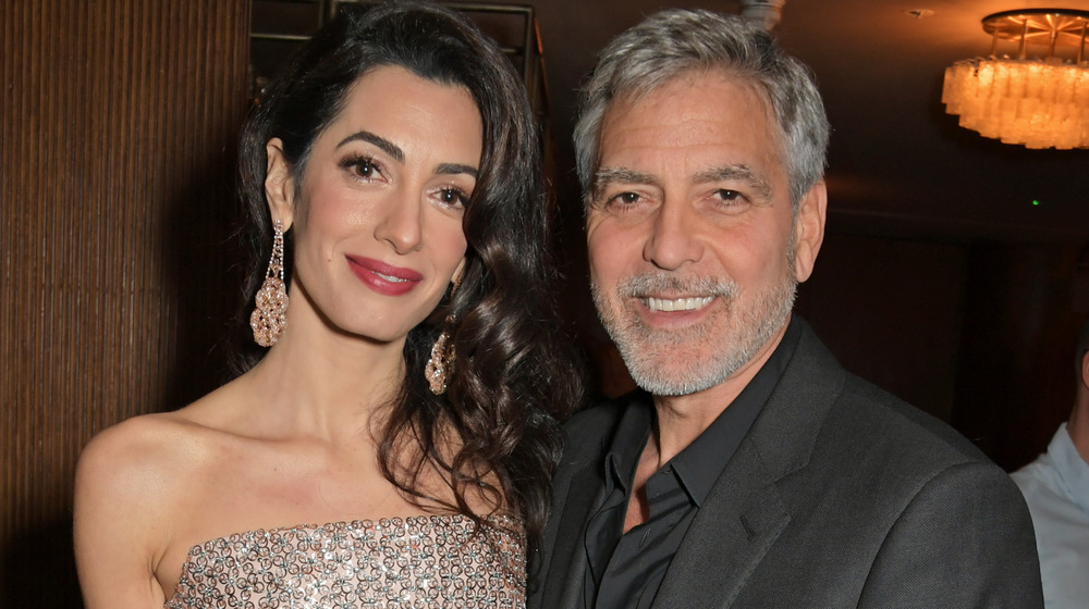 Amal Clooney and George Clooney smiling