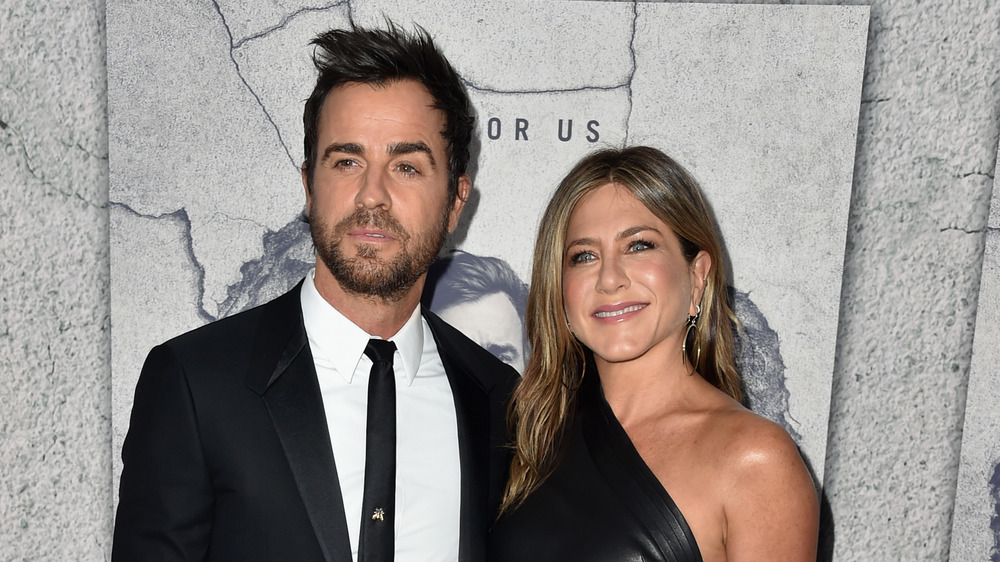 Justin Theroux and Jennifer Aniston both wear black at an event