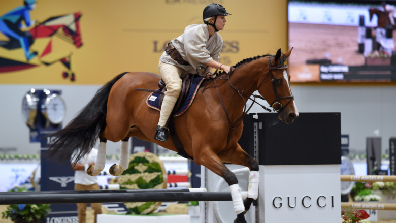 Kaley Cuoco riding at an equestrian event 