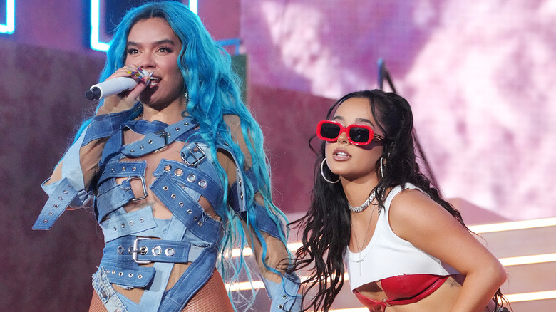 Karol G and Becky G performing on stage