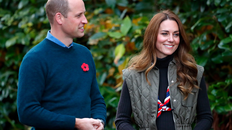 Prince William and Kate Middleton speaking with guests at a reception for the key members of the Sustainable Markets Initiative 