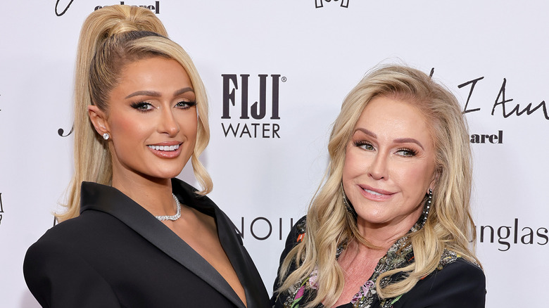 Paris Hilton, posing with her mom Kathy Hilton