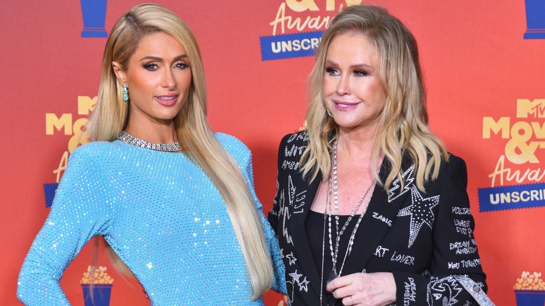 Paris Hilton, posing with Kathy Hilton, both smiling