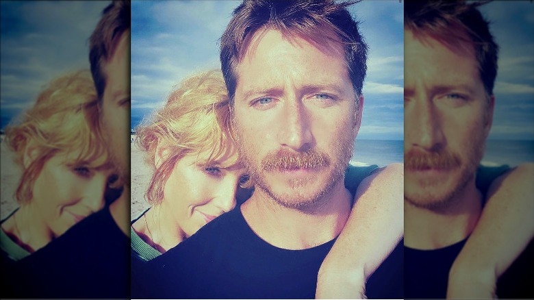 Kelly Reilly, cuddling her husband