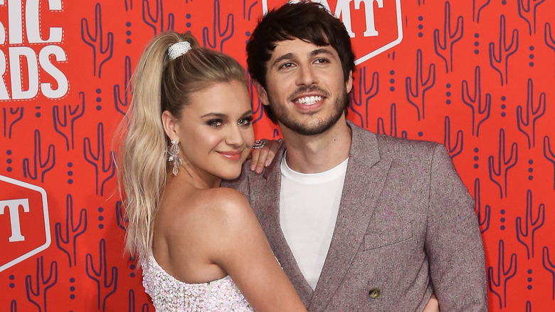 Kelsea Ballerini and Morgan Evans posing at the 2019 CMT Awards