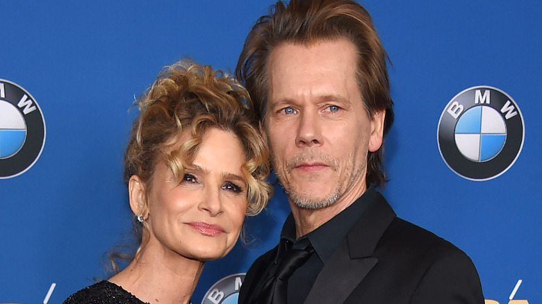 Kyra Sedgwick and Kevin Bacon posing