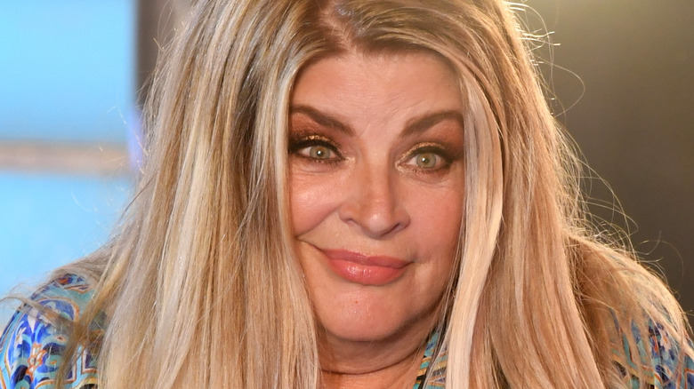 Kirstie Alley shrugging shoulders