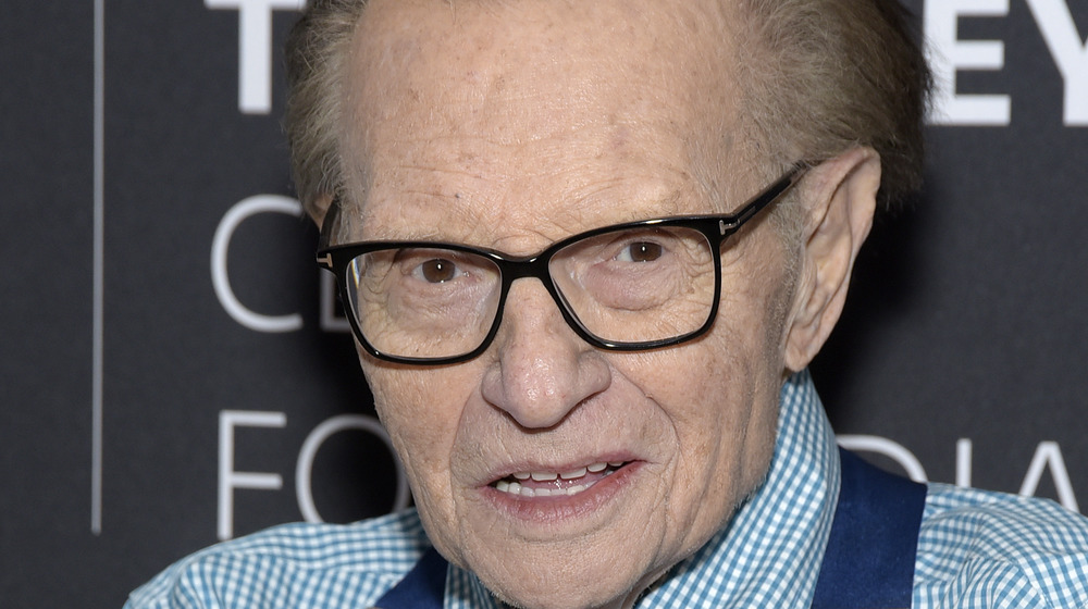 Larry King poses