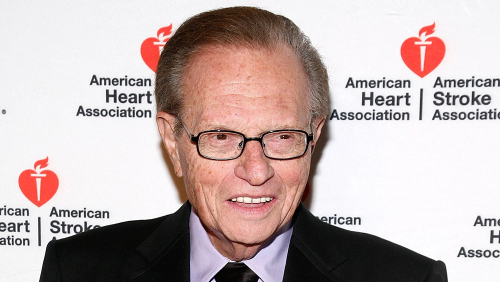 Larry King poses