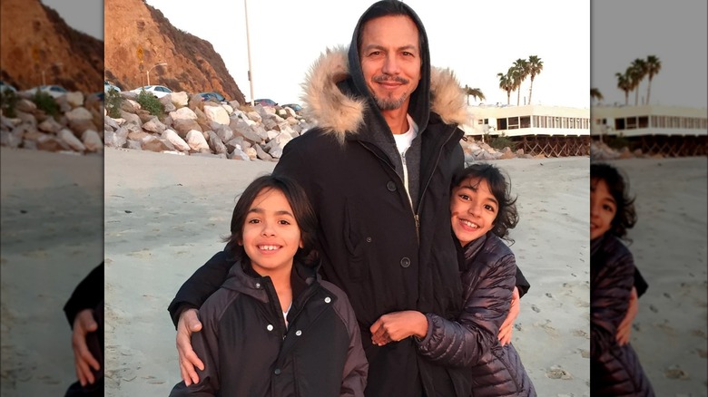 Benjamin Bratt with his kids beach