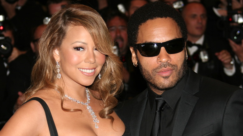 Mariah Carey and Lenny Kravitz pose on the red carpet