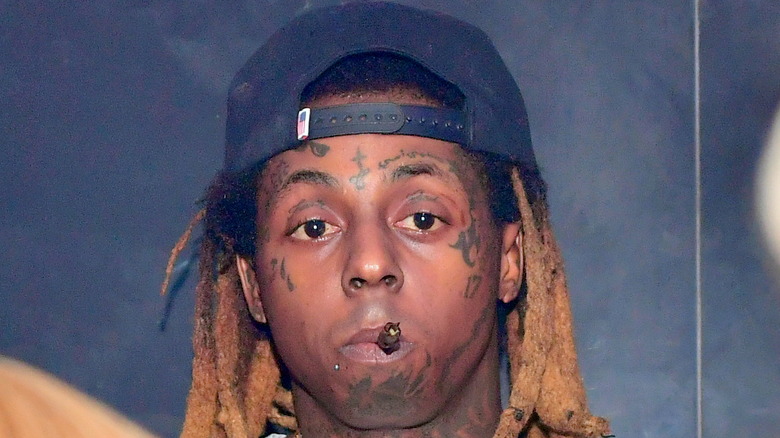 Lil Wayne smoking a cigar 