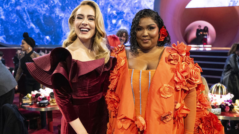 Lizzo and Adele smiling at Grammy Awards