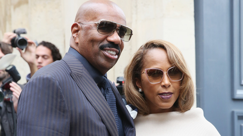 Steve Harvey and Marjorie Bridges Woods attend the Christian Dior show