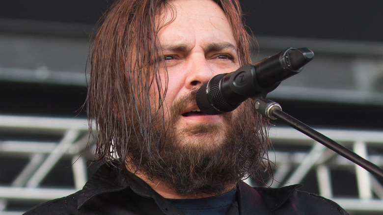 Shaun Morgan playing a pink guitar on stage