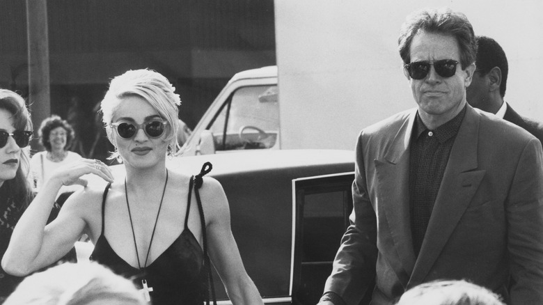 Madonna and Warren Beatty arrive at a premiere