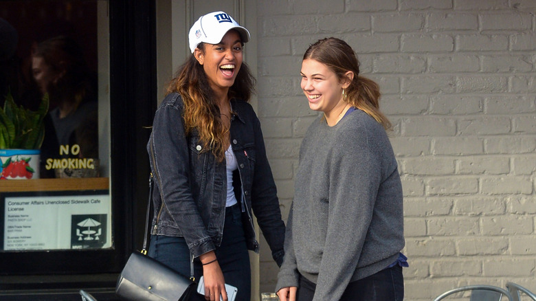 Malia Obama smiling with a friend