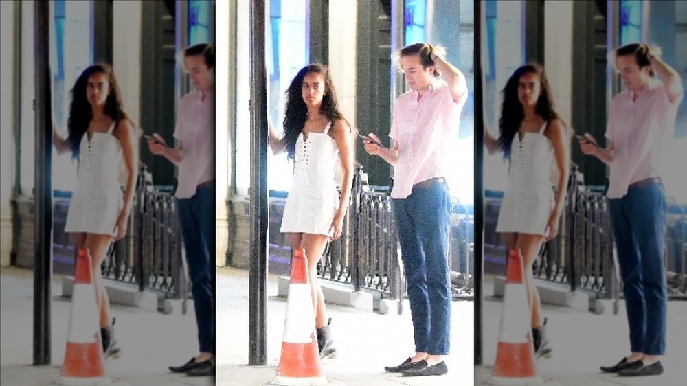 Malia Obama and Rory Farquharson walking down the street 