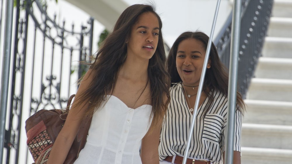 Malia Obama and Sasha Obama walking together