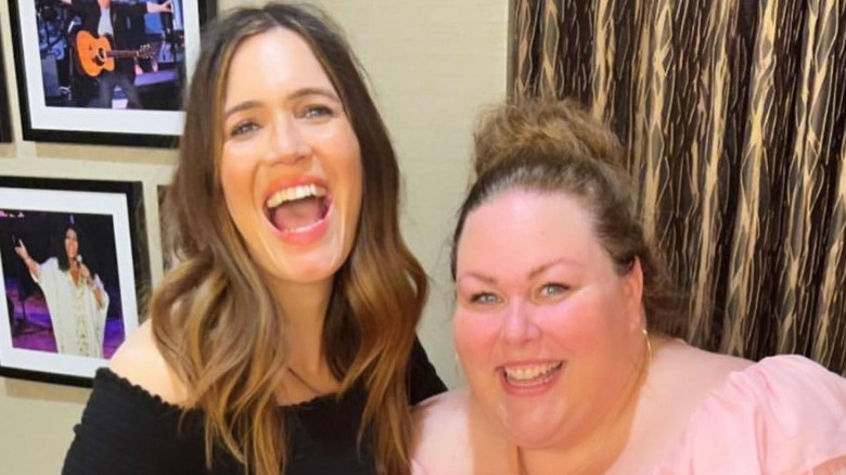 Mandy Moore and Chrissy Metz smile backstage at one of Mandy's shows