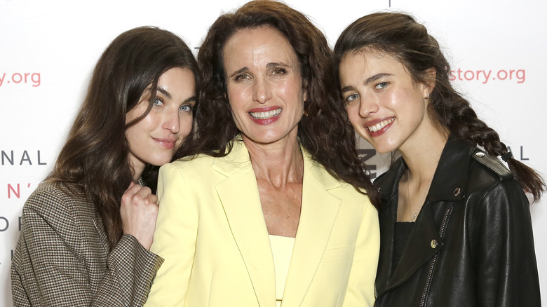 Margaret and Rainey Qualley on a red carpet with their mom, Andie McDowelll