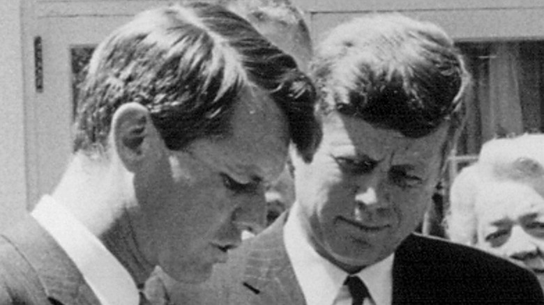 John F. Kennedy looking at Robert Kennedy