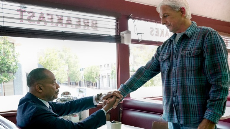 NCIS stars Rocky Carroll and Mark Harmon shaking hands