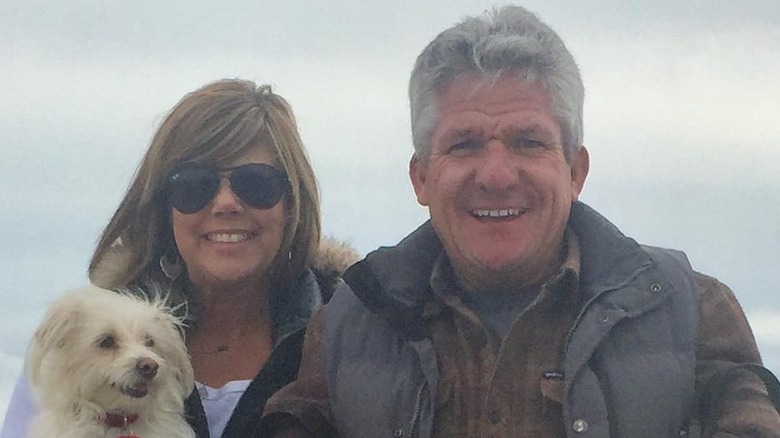 Caryn Chandler and Matt Roloff with dog