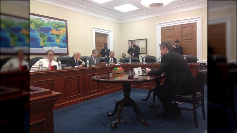 Matthew Perry speaking with a Congressional committee