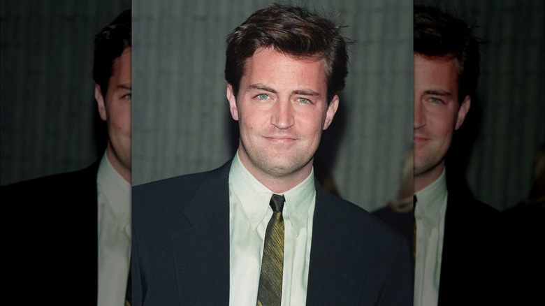 Matthew Perry posing in the late '90s