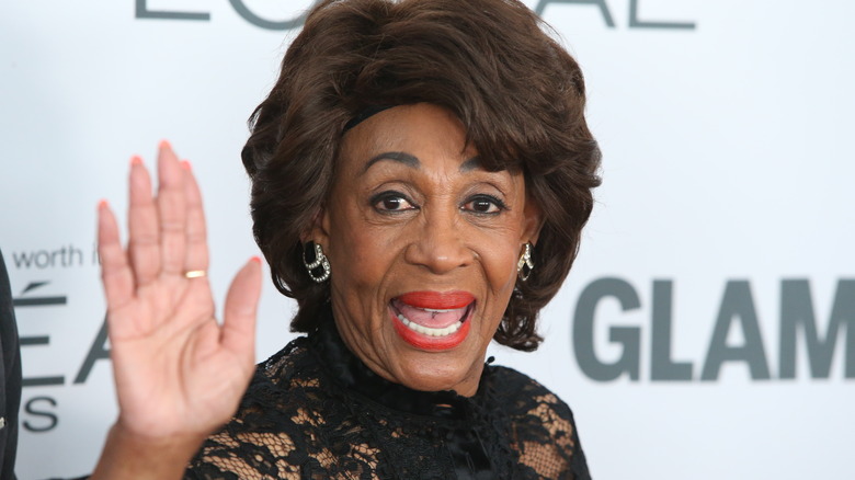 Maxine Waters waving at the camera