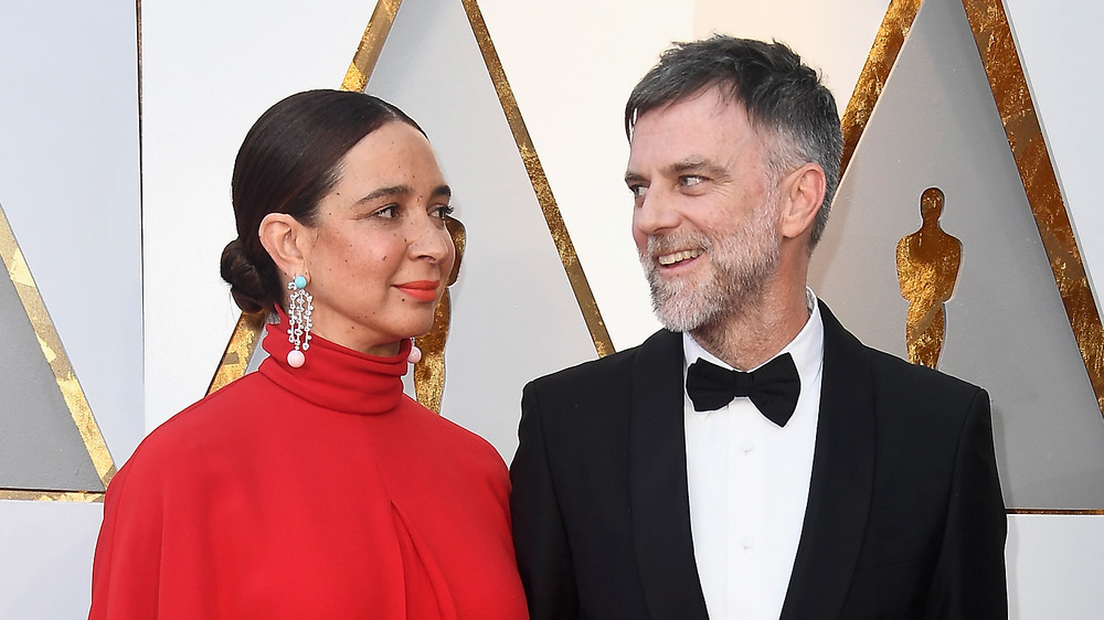 Maya Rudolph and Paul Thomas Anderson smile red carpet