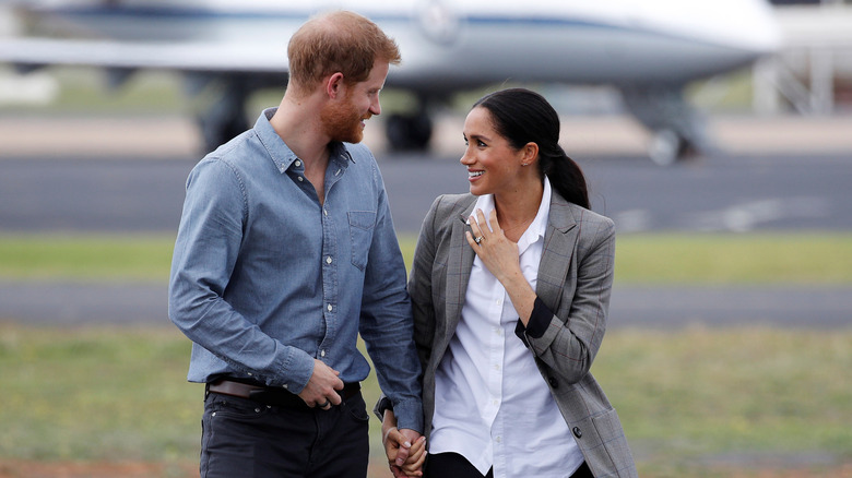 Prince Harry and Meghan Markle looking at each other 